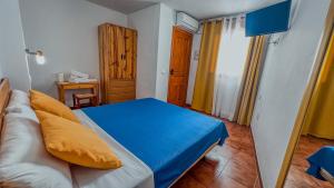 Postel nebo postele na pokoji v ubytování La Tortuga Lodging Rooms