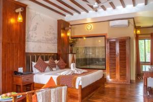 Voodi või voodid majutusasutuse Hotel Jungle Crown toas