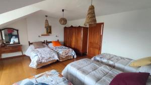 a living room with a couch and a bed at El huerto de la Reina in Becerril de la Sierra +64 photos
