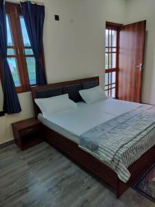 Postel nebo postele na pokoji v ubytování Blue Bell Homestay