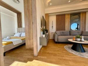 a hotel room with a bed and a couch at Maria Luxury Apartment in Skopje
