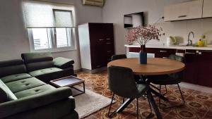 a living room with a couch and a table at Apartment Seventh Continent in Šibenik +75 photos