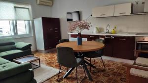 a kitchen and a table in a living room at Apartment Seventh Continent in Šibenik
