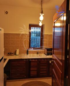 Kuchyň nebo kuchyňský kout v ubytování Beit El Ezz - Les Suites