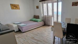 Postel nebo postele na pokoji v ubytování Apartments Magdalena + 37 fotografií