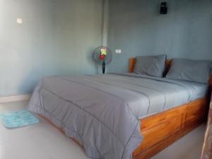 a bedroom with a large bed in a room at NURBATA HOLDING'S Hostel in Kuta Lombok