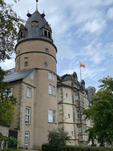 a building with a clock tower on top of it at Ferienwohnung Hermannsblick in Detmold