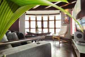 a living room with a couch and a table at Casa del Álamo in Cambil