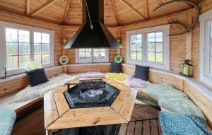 a living room with a fireplace in a log cabin at 4 Bedroom Gorgeous Home In Bagn in Bagn