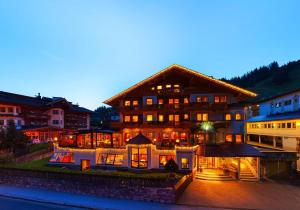 a large building with a lot of lights at Hotel Kristall - Adults Only in Gerlos