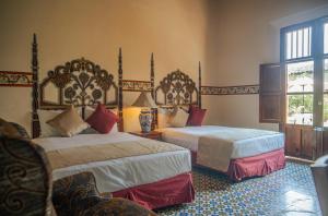 Voodi või voodid majutusasutuse Hotel Montecillo toas