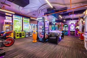 a room with many arcade games and a gaming console at Westgate Resort- 1 BR, Resort Amenities, Shopping and Restaurants! in Park City
