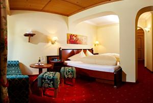 Postel nebo postele na pokoji v ubytování Hotel Kristall - Adults Only