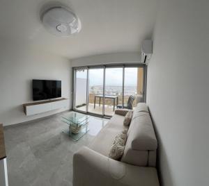 Televiisor ja/või meelelahutuskeskus majutusasutuses Appartement vue mer