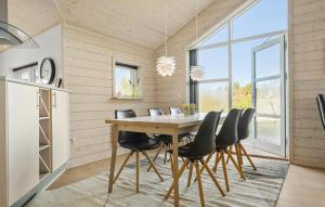 a dining room with a table and chairs at Amazing Home In Tarm With Sauna in Tarm