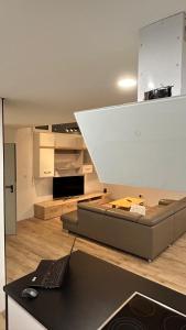 a living room with a couch and a table at Ferienwohnung Soest Lendringsen in Soest +30 photos