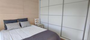 a bedroom with a bed with white walls at Casa da Barroca - Piscina Exclusiva & Natureza in Arcos de Valdevez +34 photos