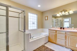 a bathroom with a tub and a shower and a sink at Patio and Grill Family Home in Pueblo West in Pueblo West +20 photos