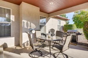 a patio with a table and chairs and a grill at Patio and Grill Family Home in Pueblo West in Pueblo West