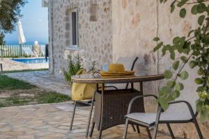 a hat sitting on a table on a patio at Gkountis Deluxe Studio in Tsoukaladhes