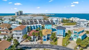 an aerial view of a residential neighborhood with houses and the ocean at Seas The Day in Navarre