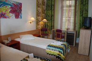 Postel nebo postele na pokoji v ubytování A1 Hotel Riga City Center