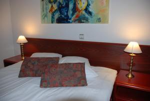 Postel nebo postele na pokoji v ubytování A1 Hotel Riga City Center