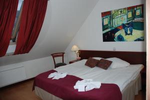 Postel nebo postele na pokoji v ubytování A1 Hotel Riga City Center