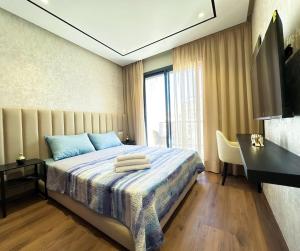 Giường trong phòng chung tại Cozy Studio Calypso 10, CFC à 2min, Parking Dispo