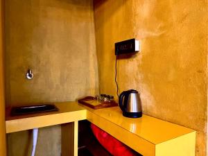 a telephone sitting on a table in a room at La Pahi Palace- Banquet and Resort in Sakri