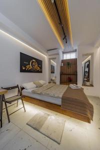 Postel nebo postele na pokoji v ubytování Keti Zemun Spa Apartment