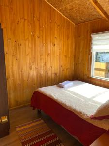 Postel nebo postele na pokoji v ubytování Cabañas la Sebastiana + 1 fotografie