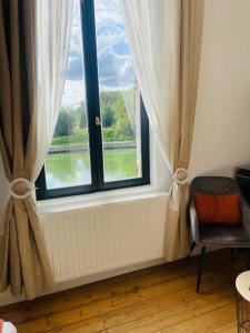 Posezení v ubytování Maison "Au fil de l'eau"