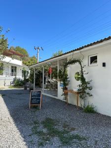 a white building with a sign in front of it at Blue Eye 5 km from AirPort Dalaman in Dalaman