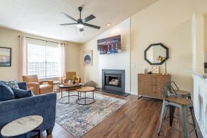 a living room with a couch and a fireplace at Affordable 4-Bedroom Retreat Near DT Cartersville in Cartersville