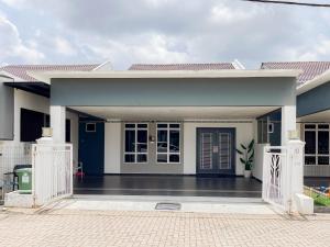 a house with a blue and white at KotaSas Summer East Persint 5 by AHM Home in Kuantan