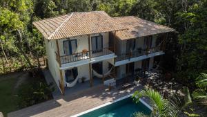 an aerial view of a house with a swimming pool at Casa Angelina in Trancoso