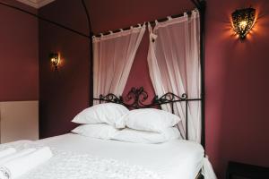 Postel nebo postele na pokoji v ubytování Hotel Riad Nour