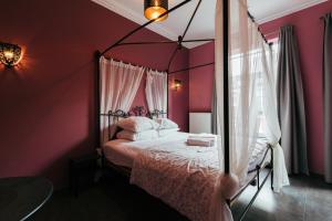 Postel nebo postele na pokoji v ubytování Hotel Riad Nour