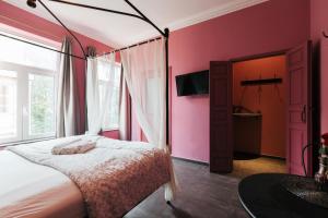 Postel nebo postele na pokoji v ubytování Hotel Riad Nour