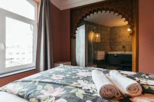 Postel nebo postele na pokoji v ubytování Hotel Riad Nour