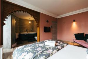 TV a/nebo společenská místnost v ubytování Hotel Riad Nour