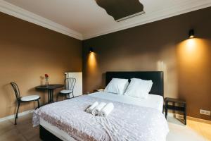 Postel nebo postele na pokoji v ubytování Hotel Riad Nour