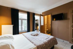 Postel nebo postele na pokoji v ubytování Hotel Riad Nour