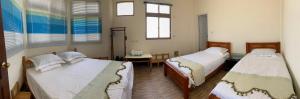 Una cama o camas en una habitación de Puchin Homestay