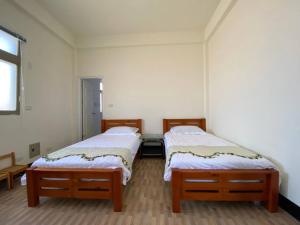Una cama o camas en una habitación de Puchin Homestay