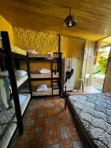 Ένα ή περισσότερα κρεβάτια σε δωμάτιο στο Chalés Recanto da Aldeia