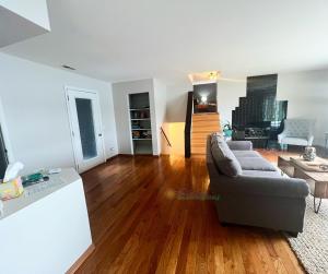 a living room with a couch and a table at S'more Fun in Traverse City