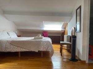 Postel nebo postele na pokoji v ubytování Atico en el casco histórico