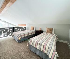 two beds sitting in a room with at All Points North in Beulah